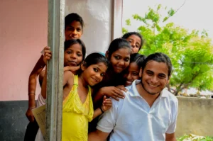 Group of people smiling near doorway – casual moment of connection and joy